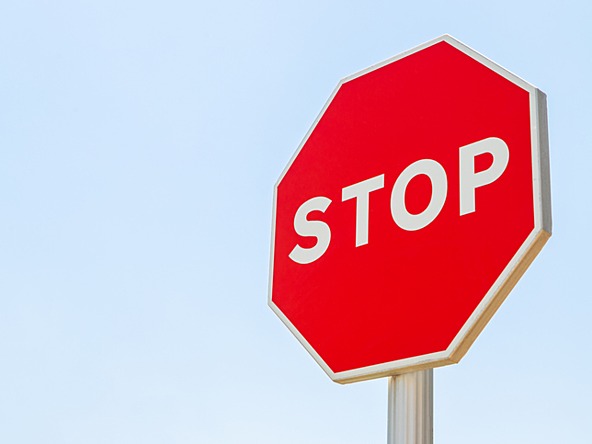 stop road sign against a sky background, concept of being ineligible for research participation